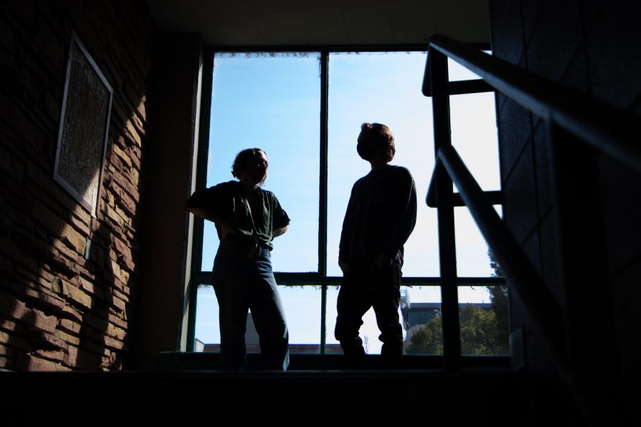 Colorado State University students chat in between buildings in Newsom Hall Sept. 24. (Grayson Reed | The Collegian)