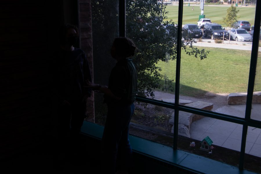 Colorado State University students chat in between buildings in Newsom Hall Sept. 24. (Grayson Reed | The Collegian)