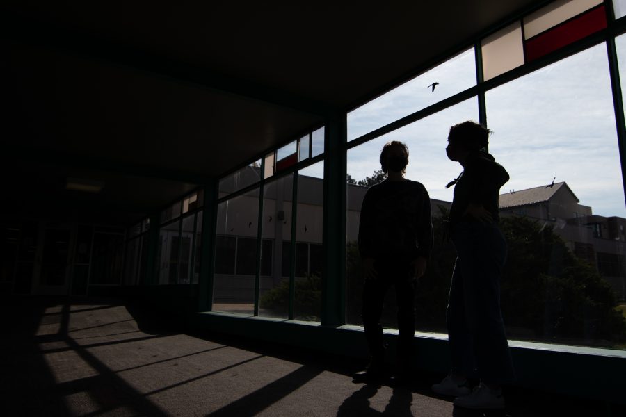 Colorado State University students chat in between buildings in Newsom Hall Sept. 24. (Grayson Reed | The Collegian)