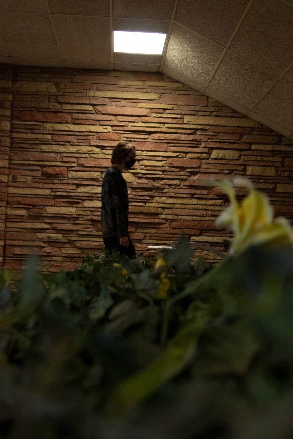 Colorado State University student walks by maintenance hallway in Newsom Hall Sept. 24. (Grayson Reed | The Collegian)