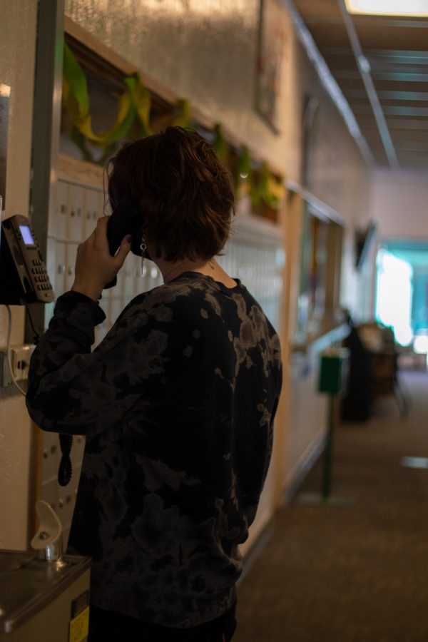 Colorado State University student takes phone call outside reception desk in Newsom Hall Sept. 24. (Grayson Reed | The Collegian)