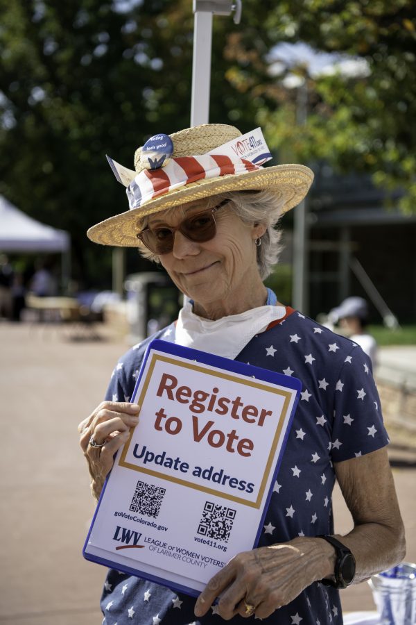 Pat Burger stands on the Colorado State University Plaza holding a voter registration form. Burger stated voting “Makes democracy work.”
Burger is part of the League of Women Voters who were set up alongside  The Associated Students of Colorado State University and New Era Colorado to help students register to vote Sept. 28. (Garrett Mogel | The Collegian) 

