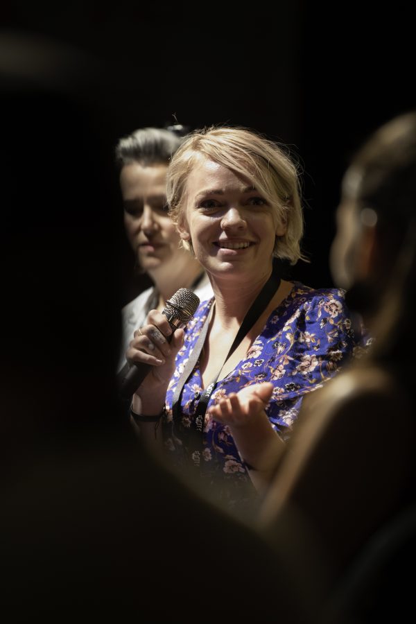 Hannah Smith turns to fellow panelist Amy Marquis to converse. Hannah Smith was one of six panelists participating in a Q&A for the Horsetooth Int'l Film Festival. Also known as HIFF the film festival took place at the Lyric in Fort Collins Colorado form September 8th to September 12th 2021.  