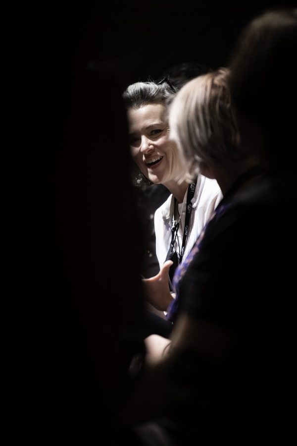Christi Clay chuckles at something said during a Q&A session for the Horsetooth Int'l Film Festival. Also known as HIFF the film festival took place at the Lyric in Fort Collins Colorado form September 8th to September 12th 2021.  
