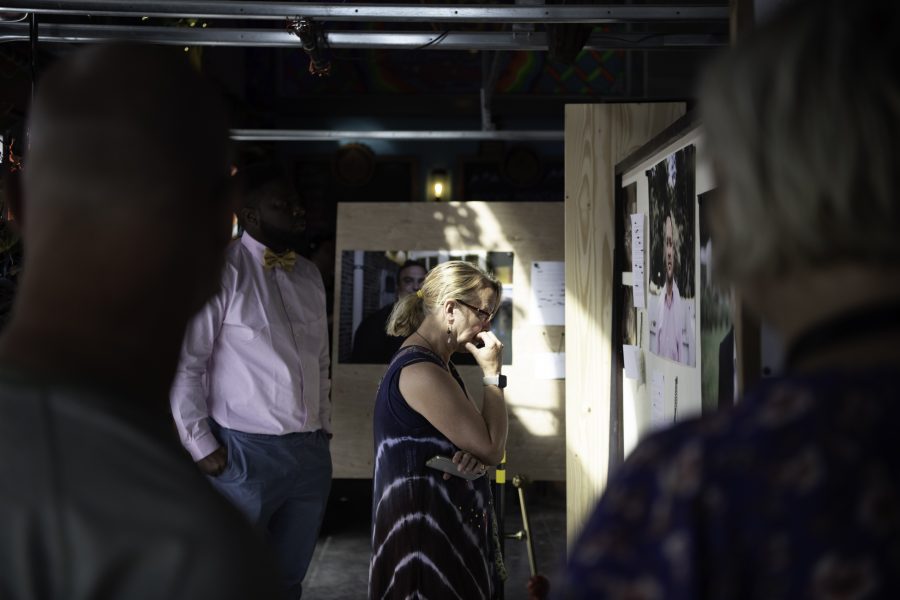 A person reads the stories behind Hannah Smiths photographs. Smiths work was displayed at the Lyric in Fort Collins Colorado as part of the Horsetooth Int'l Film Festival. Also Known as HIFF the film festival took place from September 8th to the 12th 2021.  