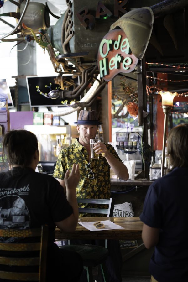 Person enjoying a cold beverage at the Lyric in Fort Collins Colorado. As part of the Horsetooth Int'l Film Festival the Lyric sold food and drink to film goers. The film festival also know as HIFF took place from September 8th to the 12th 2021.  