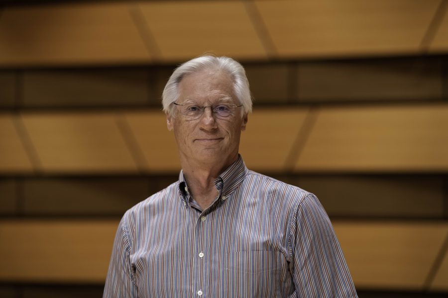Wesley Kenney, professor at Colorado State University School of Music, Theatre, and Dance, stands on stage in the concert hall in the Center for the arts building. Quote "It has been almost twenty months since we have preformed in front of a live audience. We are so excited... it is who we are."    