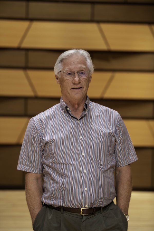 Wesley Kenney, professor at Colorado State University School of Music, Theatre, and Dance, stands on stage in the concert hall in the Center for the arts building. Quote "It has been almost twenty months since we have preformed in front of a live audience. We are so excited... it is who we are."    