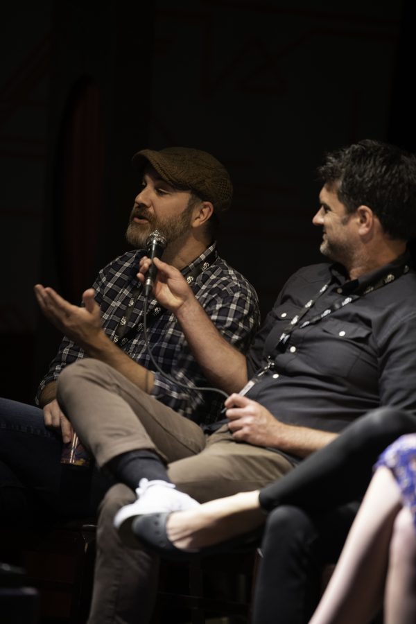 Dave Gulick (right) holds the mic for and Johnny Clay (left) to answer a question posed by an audience member. Gulick and Clay were part of a group panelists speaking at the Horsetooth Int'l Film Festival or HIFF  which took place at the Lyric in Fort Collins Colorado. 
