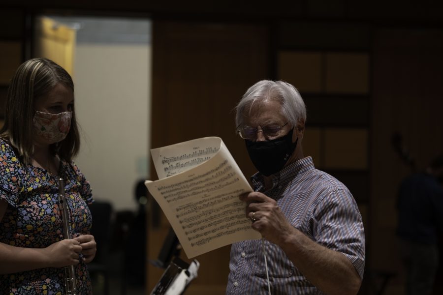 Wesley Kenney speaks with student Rebecca Needham about sheet music
