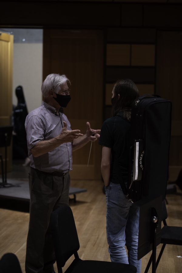 Wesley Kenney speaks with student Emily Rowe after practice on stage of the Edna Rizley Griffin Concert Hall where the CSU symphony will perform on September 23rd at 7:30pm.  