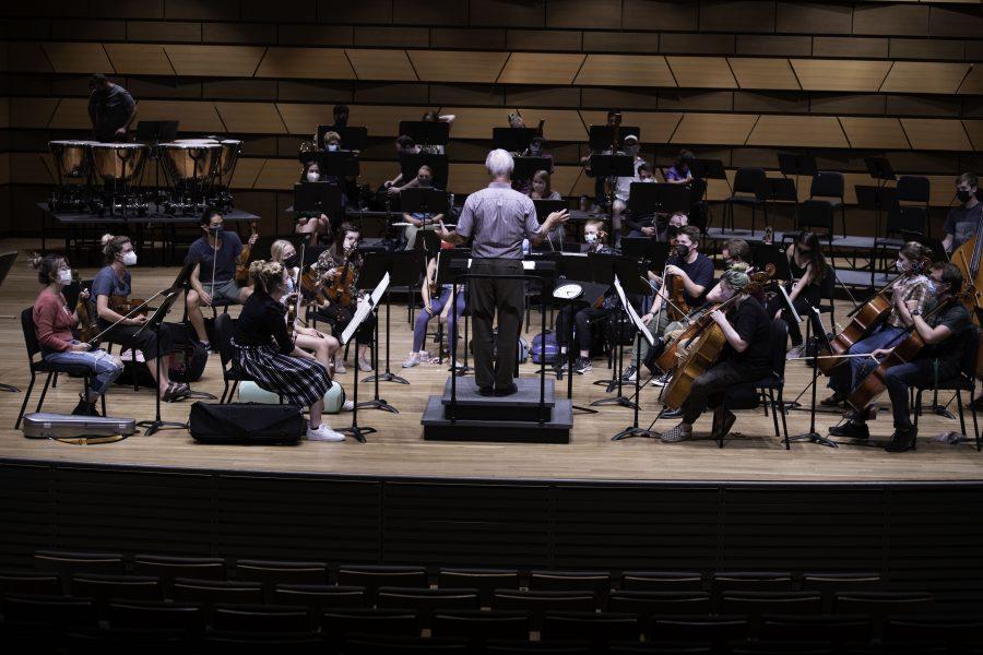 Wesley Kenney, professor and conductor at the Colorado State School of Music, Theatre, and Dance stands before his students and prepares them for an upcoming concert to be held in the Edna Rizley Griffin Concert Hall on September 23rd at 7:30pm. Mr. Kenney spoke to the upcoming concert stating that “"It has been almost twenty months since we have performed in front of a live audience. We are so excited... it is who we are." 