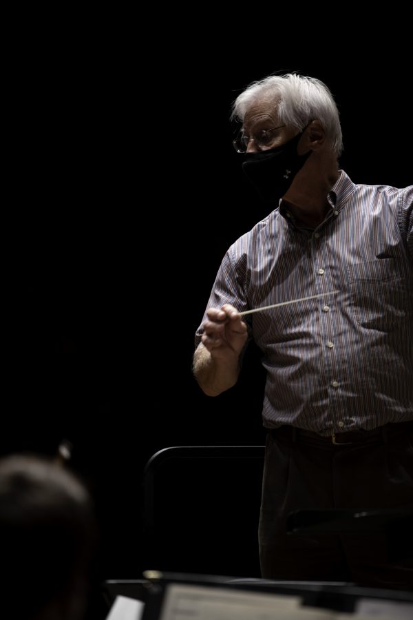 Wesley Kenney, professor and conductor at the Colorado State School of Music, Theatre, and Dance stands before his students baton in hand and prepares them for an upcoming concert to be held in the Edna Rizley Griffin Concert Hall on September 23rd at 7:30pm. Mr. Kenney spoke to the upcoming concert stating that “"It has been almost twenty months since we have performed in front of a live audience. We are so excited... it is who we are."