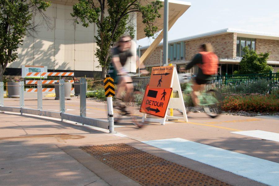 Cyclists pass through the crosswalk outside of the Lory Student Center in-between classes on Sept. 3. (Anna Tomka | The Collegian)