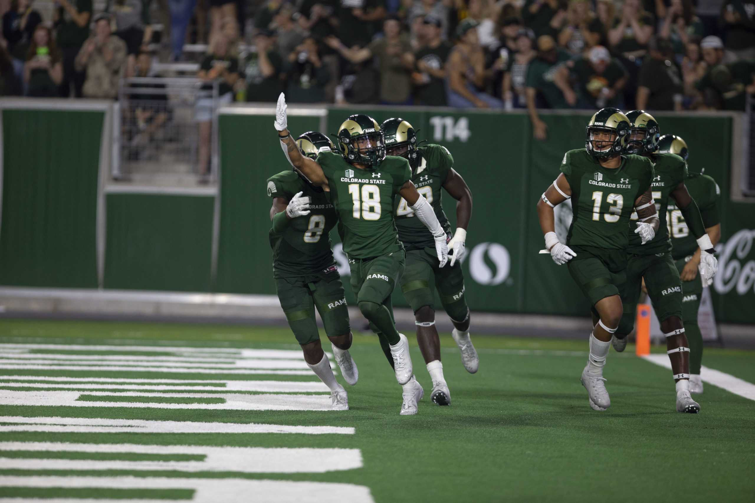 Colorado State wide receiver Thomas Pannunzio celebrates with his teammates after making a tackle near the end zone on a punt return