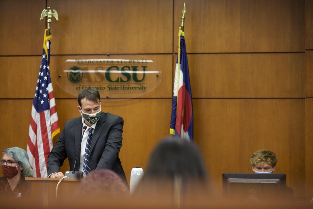 a person stands at a podium