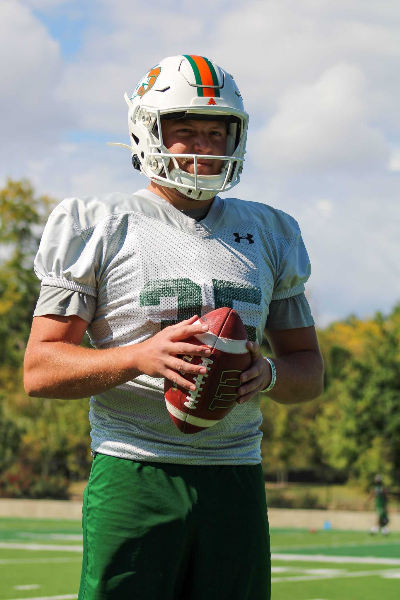 Joe Deline poses for a photo after practice