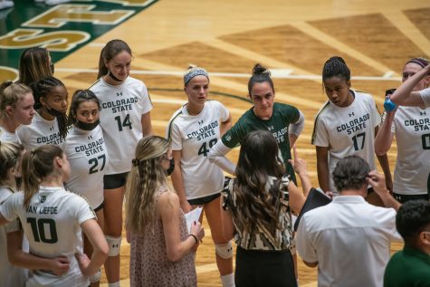 During a timeout at the beginning of the second set, players listen to associate head coach Emily Kohan Sept. 28. (Lucy Morantz | The Collegian)