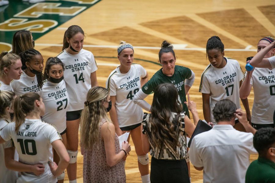 During a timeout at the beginning of the second set, players listen to associate head coach Emily Kohan Sept. 28. (Lucy Morantz | The Collegian)
