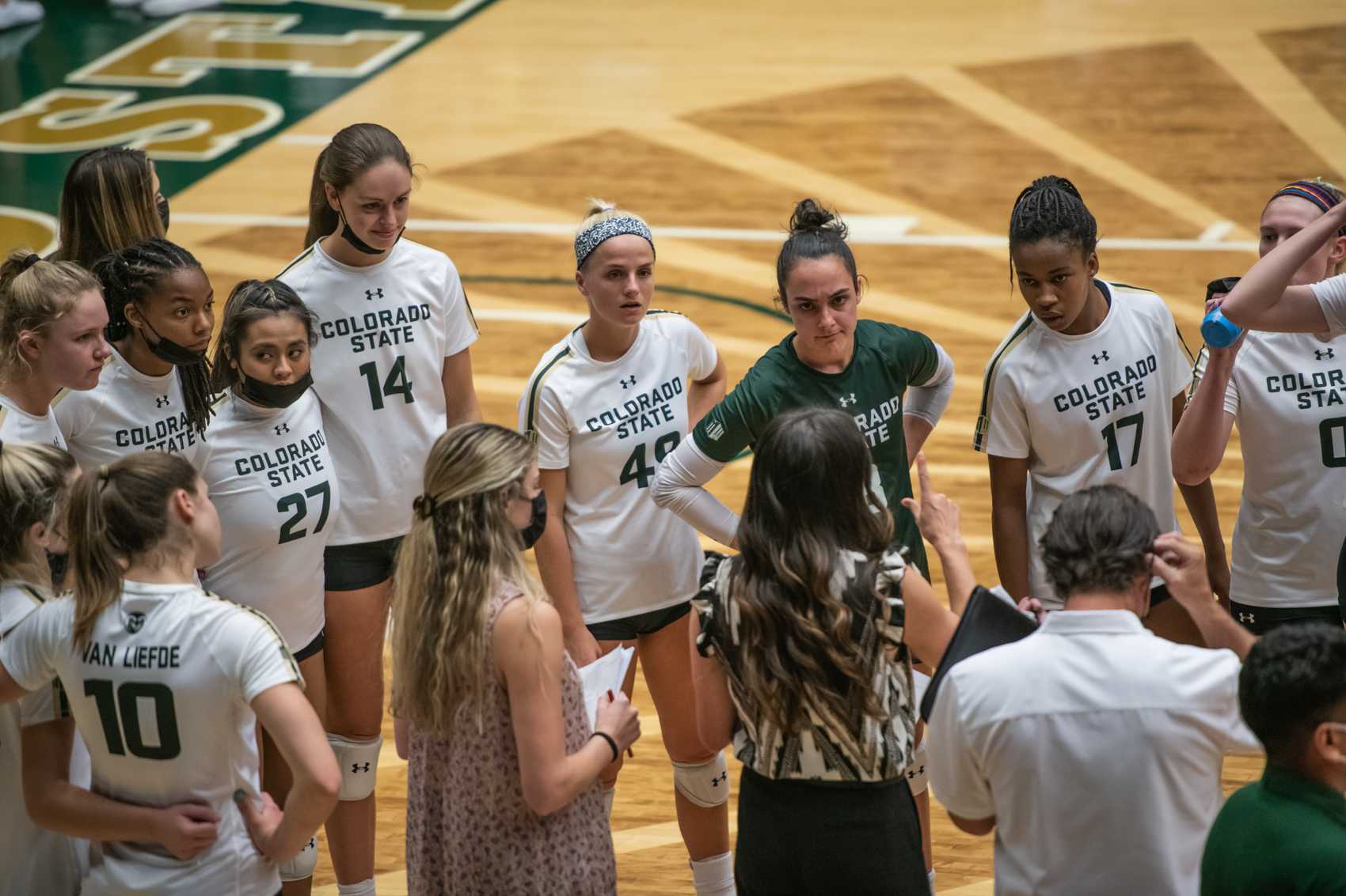 During a timeout at the beginning of the second set, players listen to Assistant Coach Emily Kohan Sept. 28.