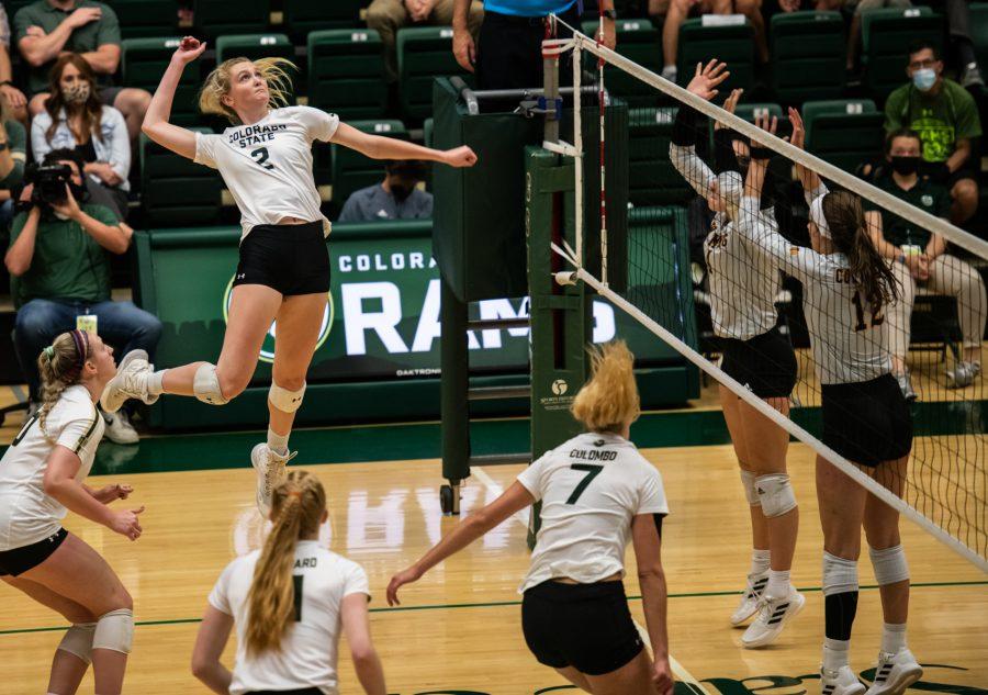 Junior Annie Sullivan (2) gets a kill in the second match against the University of Wyoming Sept. 28. (Lucy Morantz | The Collegian)