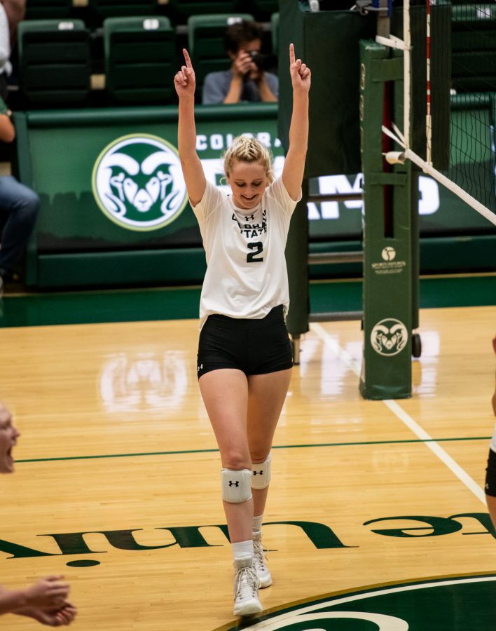 Junior Annie Sullivan (2) celebrates after getting a kill in the second set Sept. 28. (Lucy Morantz | The Collegian)