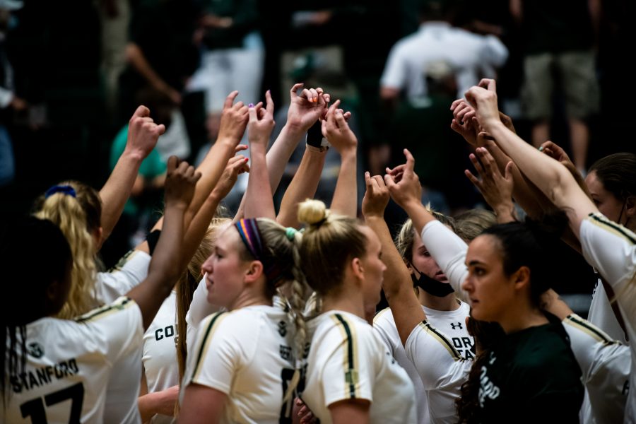 The Colorado State University volleyball team celebrates their 3-0 win over the University of Wyoming Sept. 28. (Lucy Morantz | The Collegian)