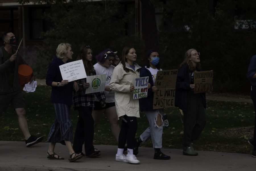 Climate crisis protestors march down West Plum Street toward the Colorado State University Oval chanting “Unionize CSU.” Oct. 8. (Garrett Mogel | The Collegian)