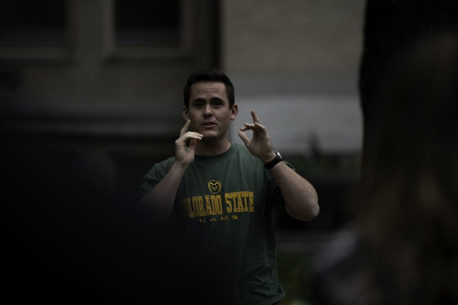 Christian Dykson speaks in front of the climate crisis protestors outside of the Colorado State University Administrative Building stating, “I care for our environment, and I have great fear for the future of our world if we don’t take action.” Oct. 8. (Garrett Mogel | The Collegian)