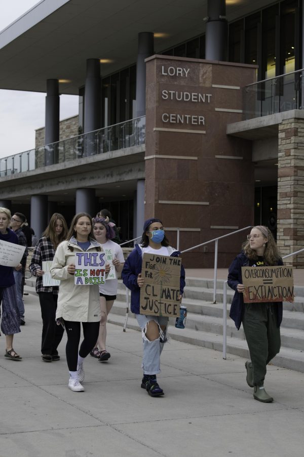 Climate crisis protestors march past the Colorado State University Lory Student Center chanting “Unionize CSU.” And shouting a call and response of “What do we want? Climate Justice. When do we want it? Now.” Oct. 8. (Garrett Mogel | The Collegian)