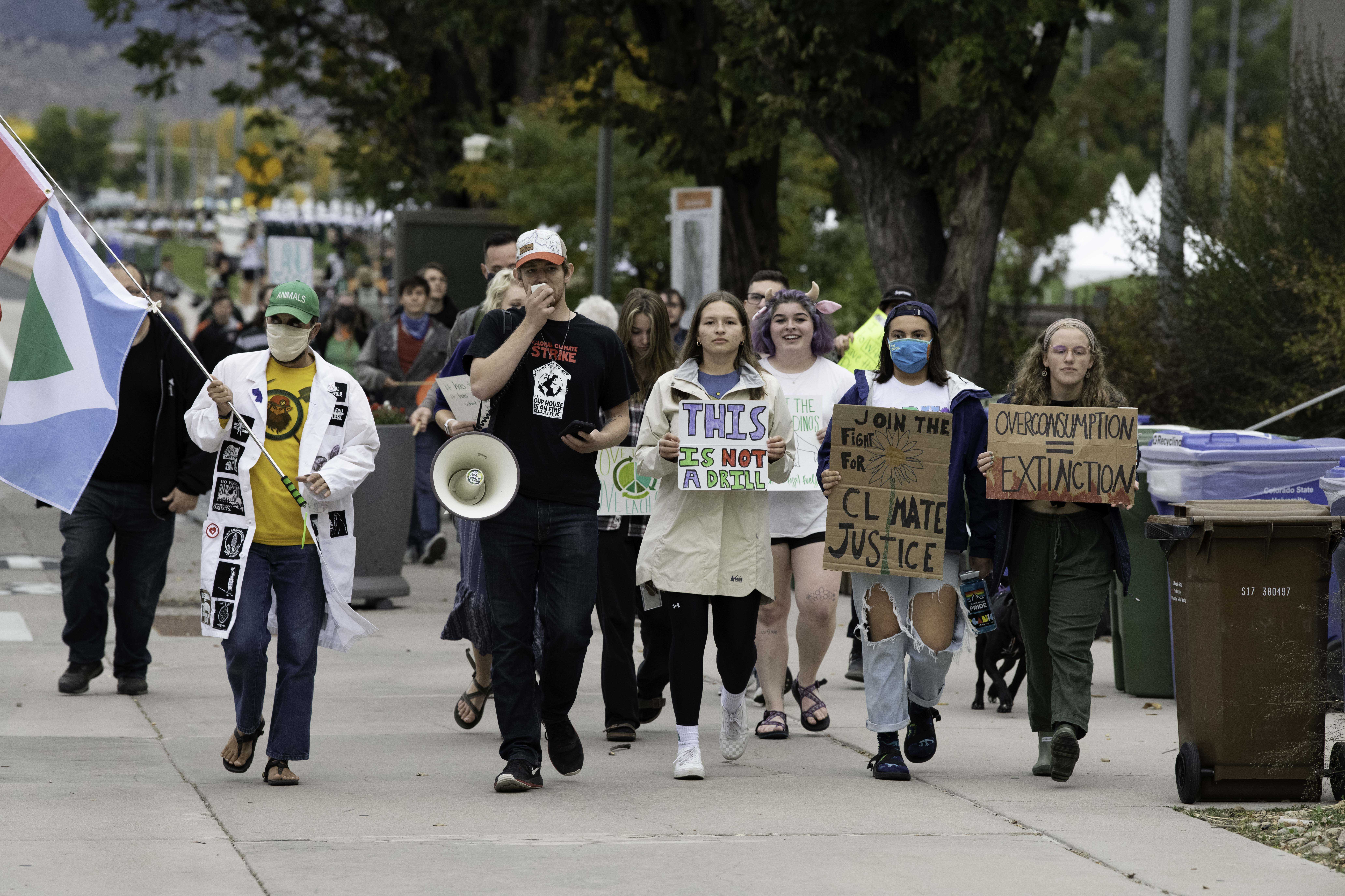 Climate crisis protestors march past the Colorado State University Lory Student Center chanting “Unionize CSU.” And shouting a call and response of “What do we want? Climate Justice. When do we want it? Now.” Oct. 8. (Garrett Mogel | The Collegian)