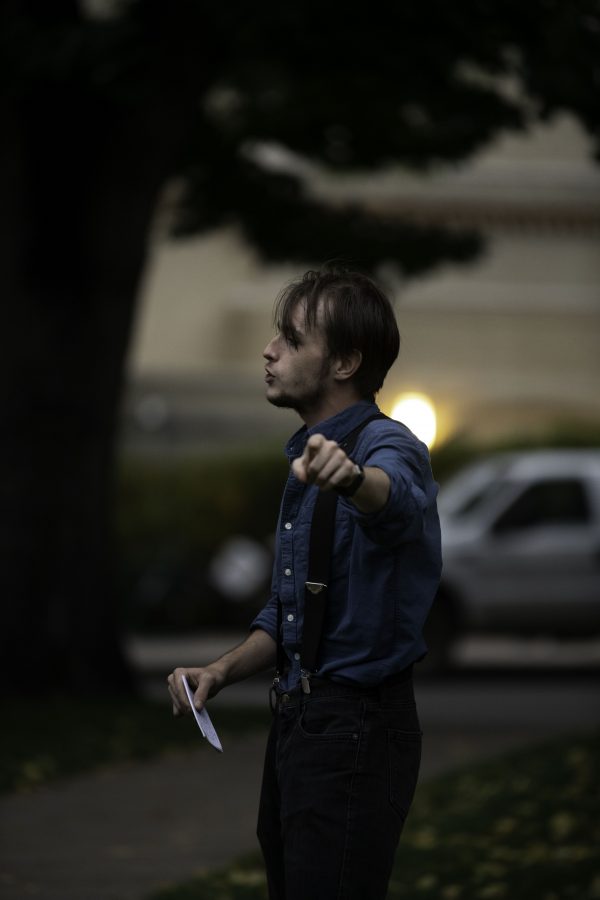 Hunter Linville speaks in front of climate crisis protestors outside the Colorado State University Administration Building about the university’s investments and land grants Oct. 8. (Garrett Mogel | The Collegian)