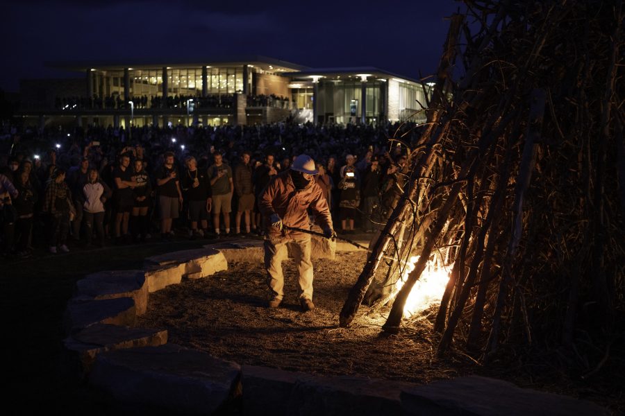 People gather outside the Colorado State University Lory Student Center to watch the Homecoming tradition of lighting a bonfire, Oct. 8. (Garrett Mogel | The Collegian)