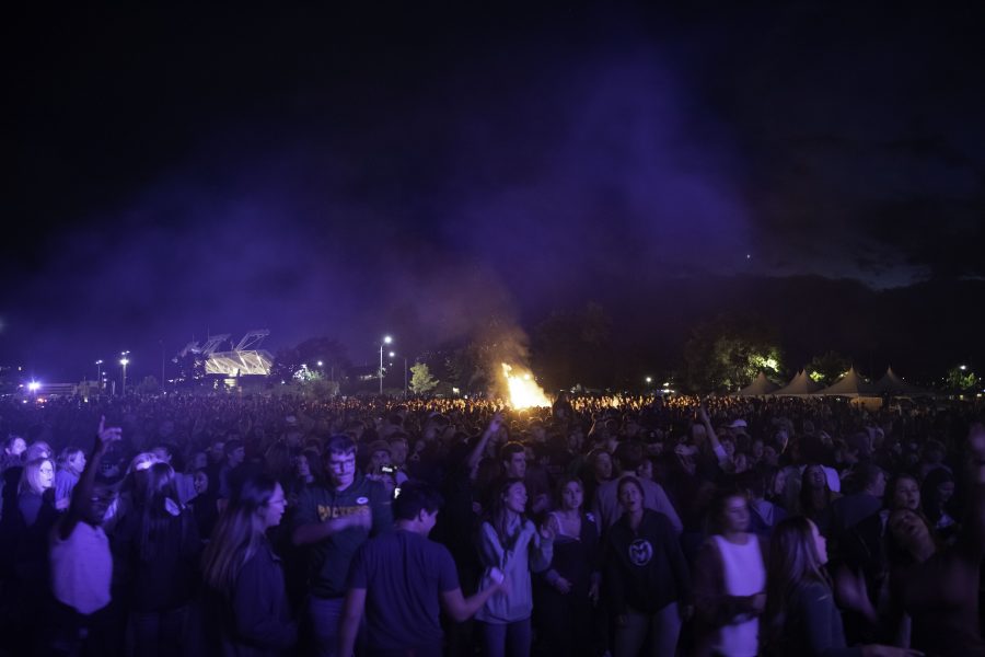 People dance outside the Colorado State University Lory Student Center before the homecoming tradition of lighting the A and fireworks display Oct. 8. (Garrett Mogel | The Collegian)