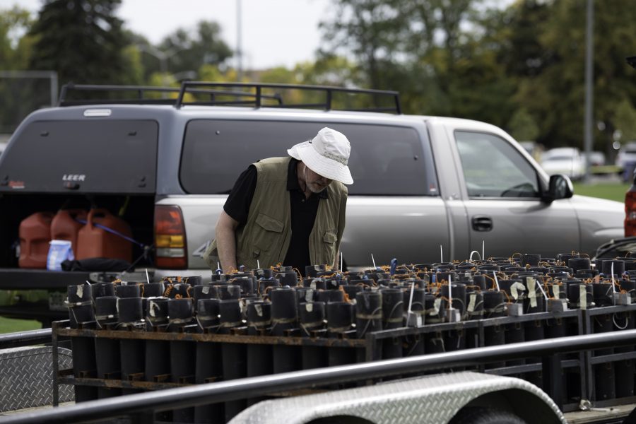 Larry Darrington, Jr. of Angel Light Pyrotechnics inspects the firework mortar tubes before the Colorado State University homecoming display Oct. 8. (Garrett Mogel | The Collegian)