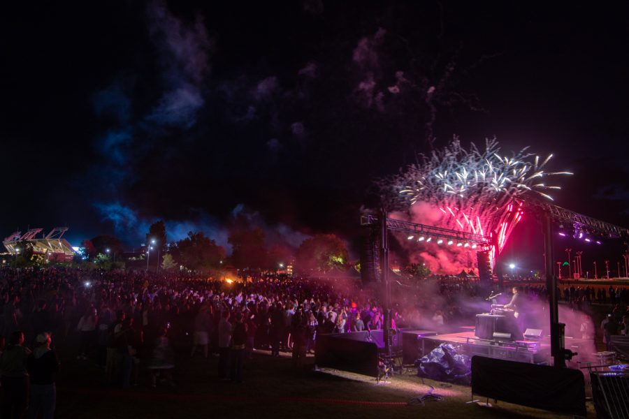 Fireworks and smoke coming from a concert stage at night.