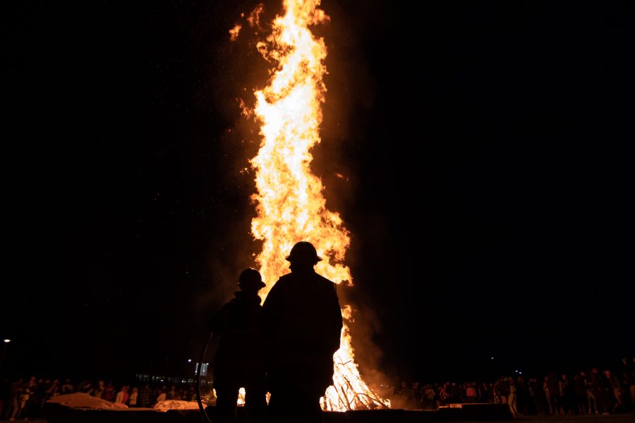 Colorado State University celebrates Homecoming by lighting a bonfire monitored by firefighters on the West lawn behind Lory Student Center Oct 08. (The Collegian | Grayson Reed)