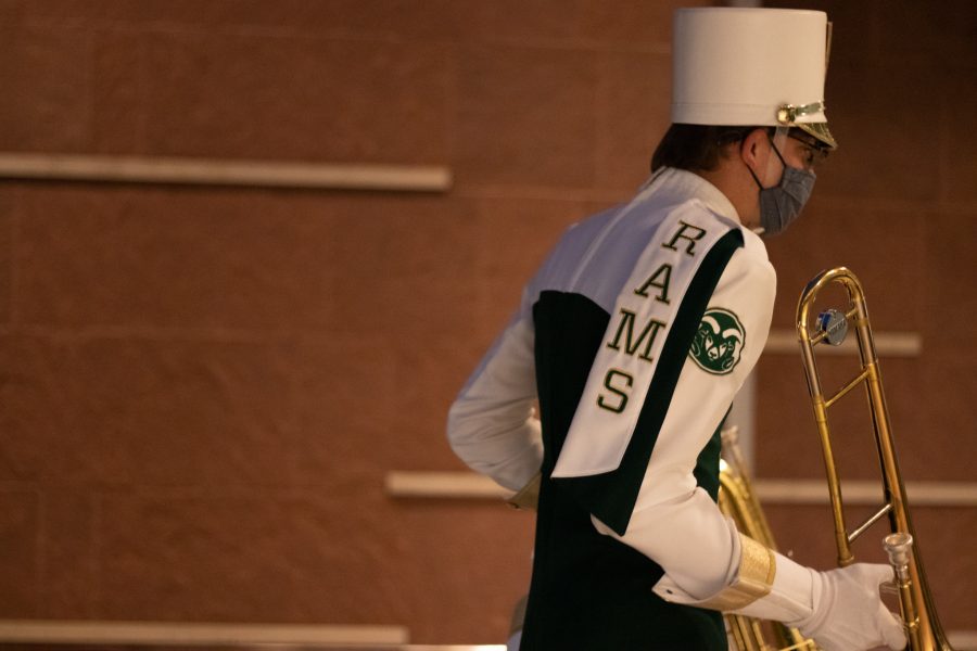 Colorado State University trombone player entering Lory Student Center after Homecoming ceremony on the West lawn Oct 08. (The Collegian | Grayson Reed)