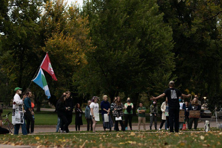 Ehret Nottingham, a Colorado State University student, stands in front of the Administration building giving a speech for the climate protest and unionization of students Oct 08. The protest was based around a cleaner campus and the equal pay to the working students who are overburdened. (The Collegian | Grayson Reed)