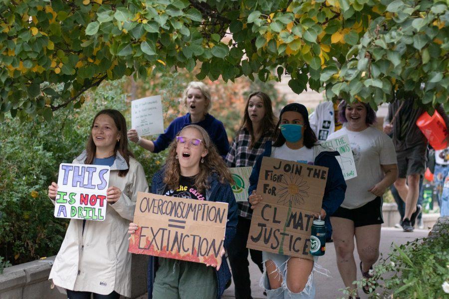 Colorado State University students parade in protest for climate change from Moby Arena to the Administration building Oct 08. The protest was based around a cleaner campus and the equal pay to the working students who are overburdened. (The Collegian | Grayson Reed)