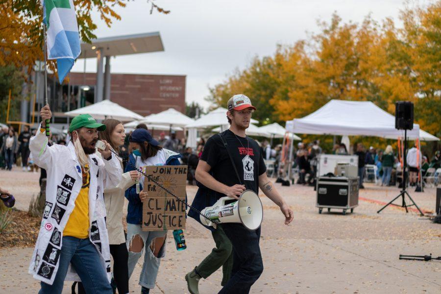 Lied Youngs, Alyssa Schaefer, Arysa Puckett and Ehret Nottingham lead a parade through The Plaza at Colorado State University in protest for climate change Oct 08. The protest was based around a cleaner campus and the equal pay to the working students who are overburdened. (The Collegian | Grayson Reed)
