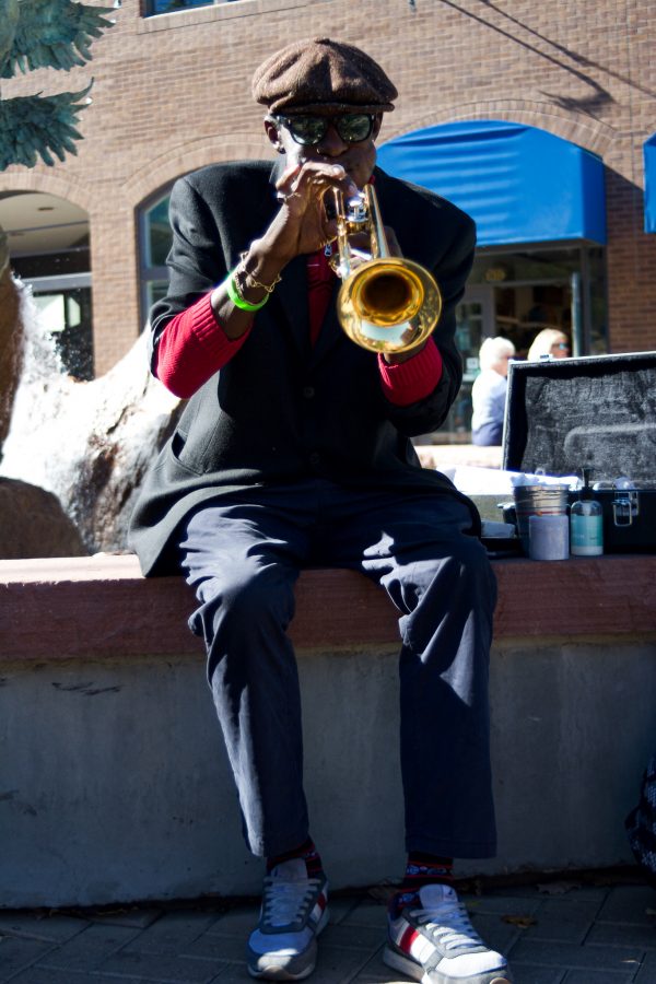 Juan Lee Reed, artist name Fuziion age 43 plays the trumpet in Old Town
