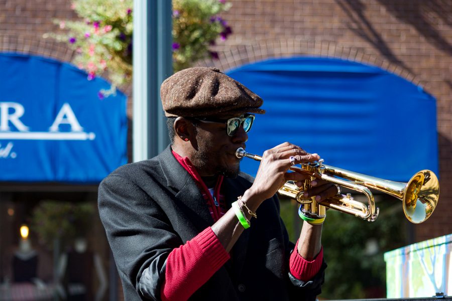 Juan Lee Reed, artist name Fuziion age 43 plays the trumpet in Old Town