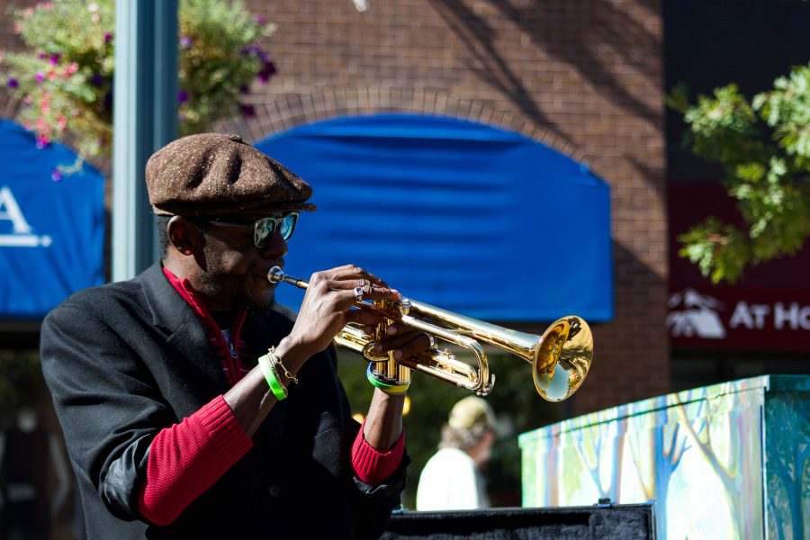 Juan Lee Reed, artist name Fuziion age 43 plays the trumpet in Old Town