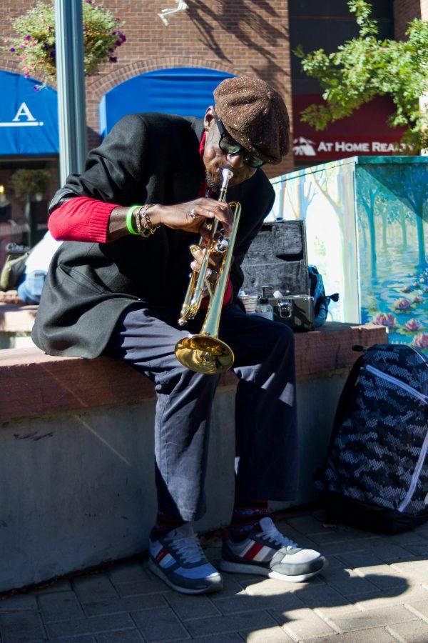 Juan Lee Reed, artist name Fuziion age 43 plays the trumpet in Old Town