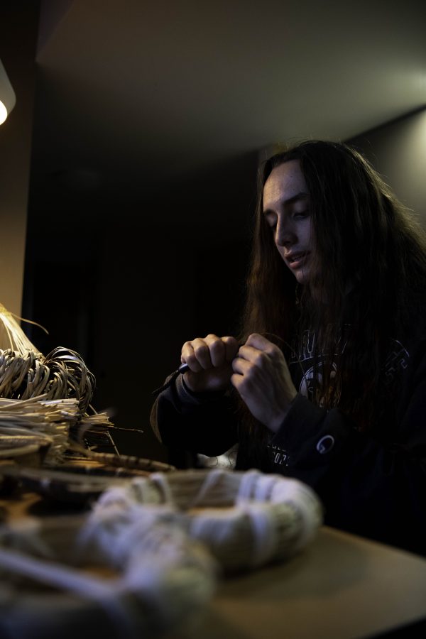 Stephen Young of the Mountain Maidu tribe sits at his kitchen table in his apartment on the Colorado State university campus weaving a basket. Young is the first in five or more generations of his family to weave basketry, learning for the past two years from tribal masters as well as on his own. Young stated “Basketry is the representation of our culture.” Oct. 12. (Garrett Mogel | The Collegian)