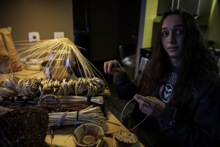 Stephen Young of the Mountain Maidu tribe sits at his kitchen table weaving traditional tribal basketry Oct. 12. Young is the first in five or more generations of his family to weave basketry, learning for the past two years from tribal masters as well as on his own. “Baskets are the primary tools of life among all Californian Native people and many people in the Great Basin,” Young said. (Garrett Mogel | The Collegian)