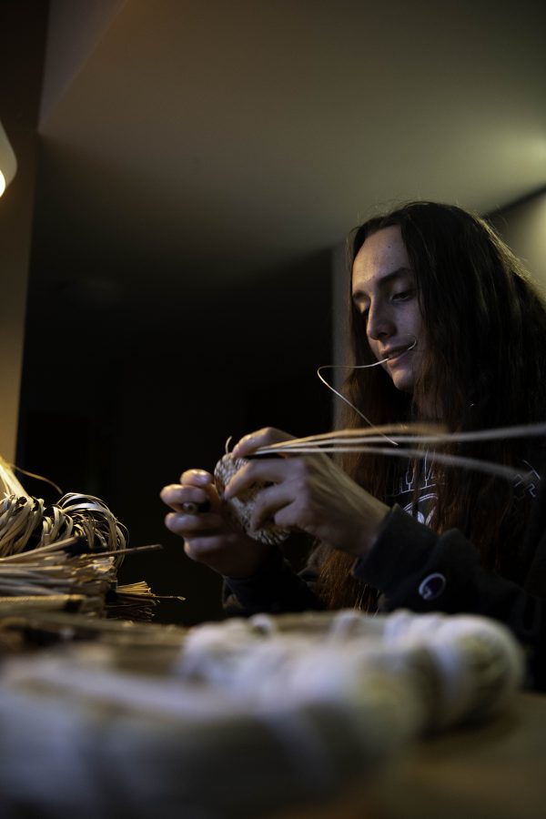 Stephen Young of the Mountain Maidu tribe sits at his kitchen table in his apartment Oct. 12. Young is the first in five or more generations of his family to weave basketry, learning for the past two years from tribal masters as well as on his own. “Basketry is the representation of our culture,” Young said. (Garrett Mogel | The Collegian)