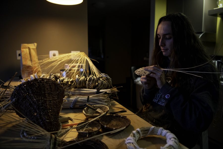 Stephen Young of the Mountain Maidu tribe sits at his kitchen table weaving traditional tribal baskets Oct. 12. Young is the first in five or more generations of his family to weave basketry, learning for the past two years from tribal masters as well as on his own. “Baskets are the primary tools of life among all Californian Native people and many people in the Great Basin,” Young said. (Garrett Mogel | The Collegian)