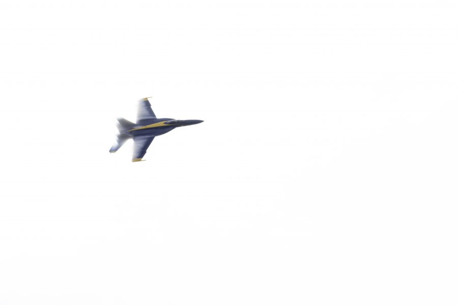 A United States Navy Blue Angel aircraft has a vapor cloud forming over it's wings while practicing for the Great Colorado Air Show at the Northern Colorado Regional Airport in Loveland Colorado. It has been 19 years since the Blue Angels last flew in Loveland and chose to do so on their 75th Anniversary Oct. 14. (Garrett Mogel | The Collegian)